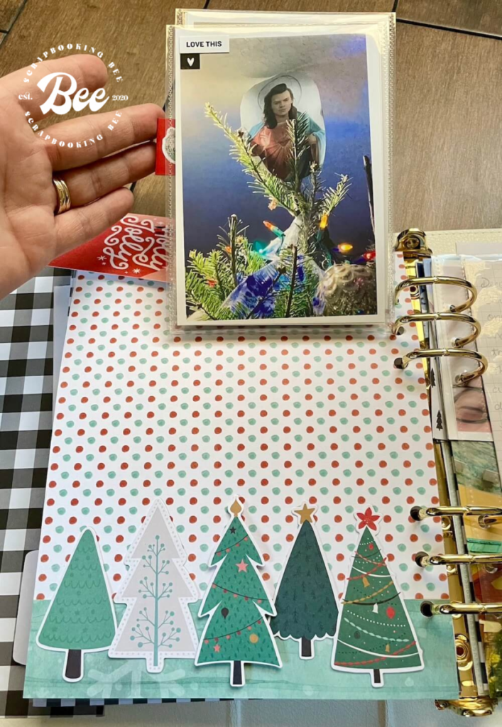 A page in Amanda's 2020 December Daily album with 4x6 flip pages featuring our family decorating our Christmas tree.