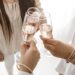 a group of women cheersing with wine